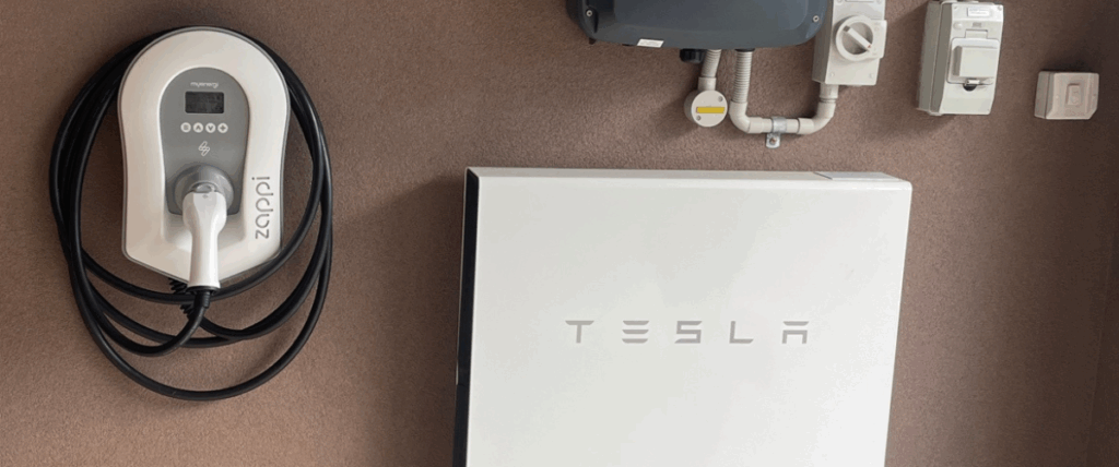 A Tesla Powerwall installed with a myenergi zappi EV charger. The perfect home solar battery system pairing.