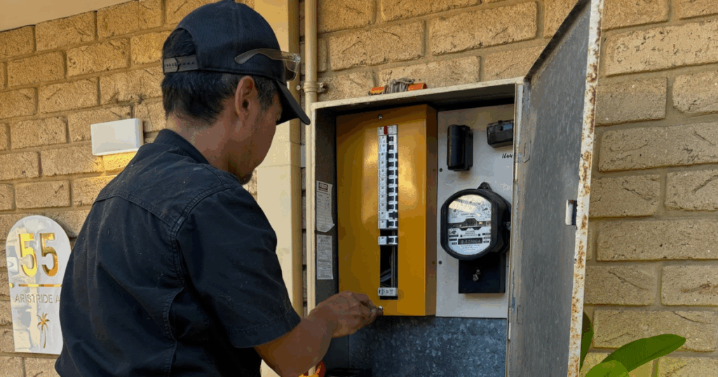 Home electrician installing EV charger and upgrading switchboard — Home Electrical Upgrades for EV Charging