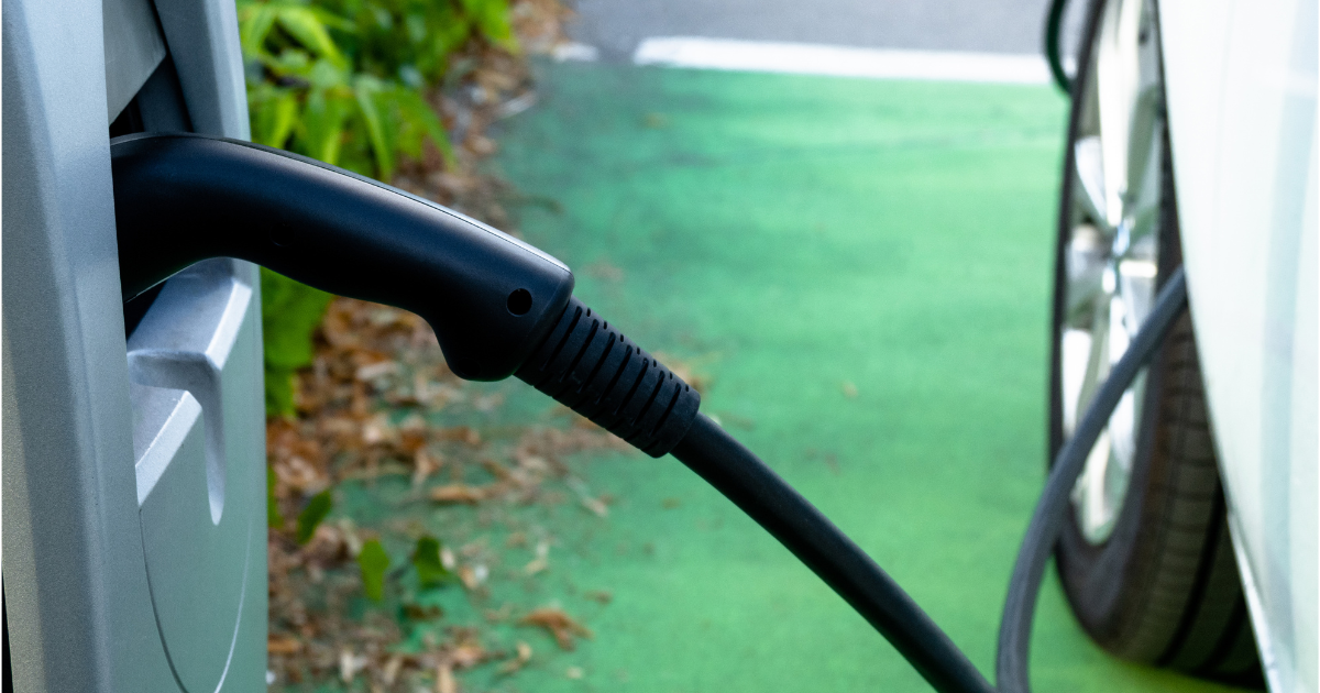 Charging cable connected to an EV charger station - EV Charging Explained
